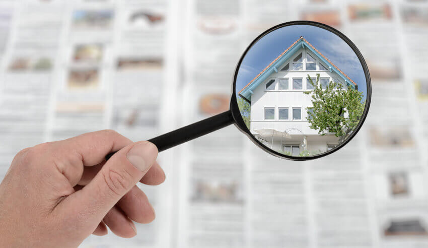 magnifying property newspaper spi