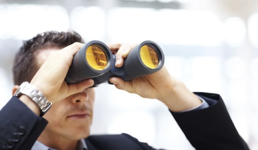 man with binoculars looking forward